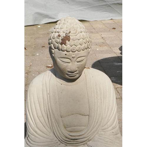 1086 - A reconstituted stone figure of Buddha, 42cm high