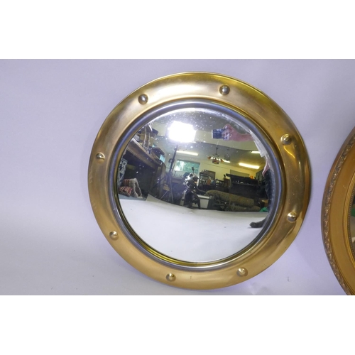 1087 - A vintage convex wall mirror with brass frame, 48cm diameter, another with pierced frame and a large... 