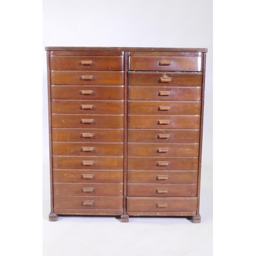 1101 - A mid century mahogany filing cabinet comprising 22 slide drawers, 80 x 37 x 90cm