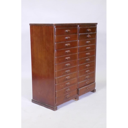 1101 - A mid century mahogany filing cabinet comprising 22 slide drawers, 80 x 37 x 90cm