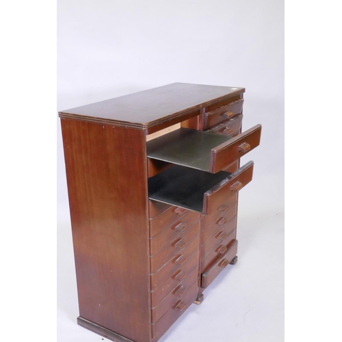 1101 - A mid century mahogany filing cabinet comprising 22 slide drawers, 80 x 37 x 90cm