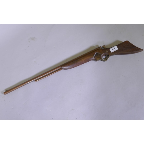 111 - A child's toy rifle, 74cm long