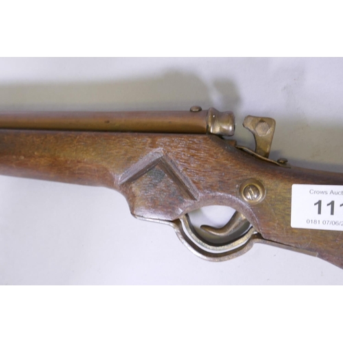 111 - A child's toy rifle, 74cm long