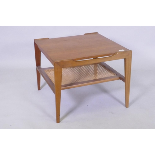 1131 - A mid century teak two tier occasional table with caned under tier, 60 x 60 x 49cm