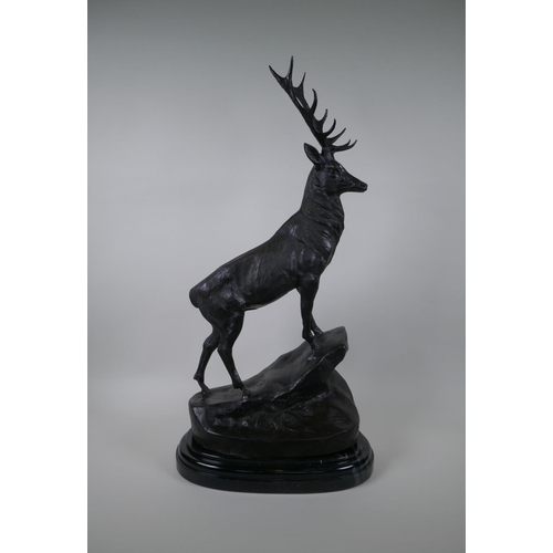 120 - After Jules Moigniez, (French 1835-1894), a bronze stag, standing on a rocky outcrop, 72cm high