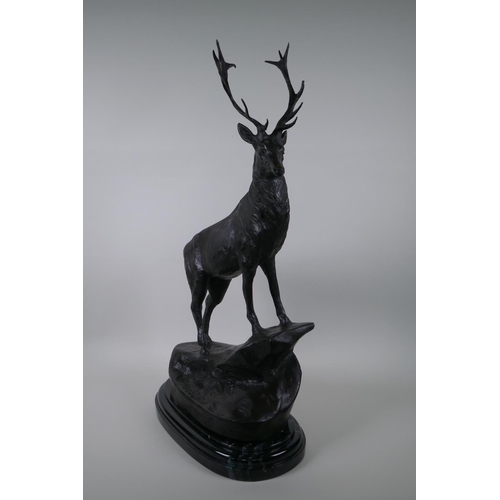 120 - After Jules Moigniez, (French 1835-1894), a bronze stag, standing on a rocky outcrop, 72cm high