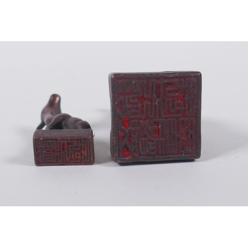 126 - A Chinese miniature bronze twin deer seal with the remnants of gilt patina, 5cm high