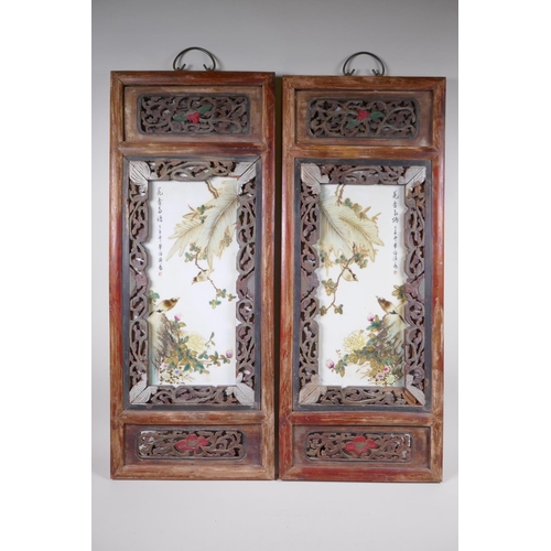 131 - A pair of early C20th Chinese polychrome porcelain panels decorated with birds amongst flowers, moun... 