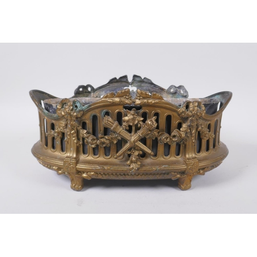 136 - An antique empire style gilt metal planter decorated with torcheres, arrow quivers and floral swags,... 