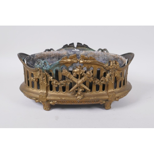 136 - An antique empire style gilt metal planter decorated with torcheres, arrow quivers and floral swags,... 