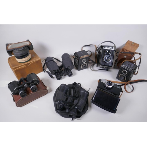 144 - Three vintage medium format film cameras including two Voigtlander Brilliant Compur and Lubitel 2, a... 