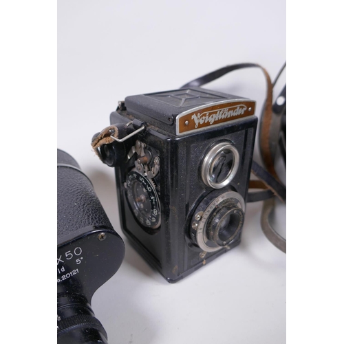 144 - Three vintage medium format film cameras including two Voigtlander Brilliant Compur and Lubitel 2, a... 