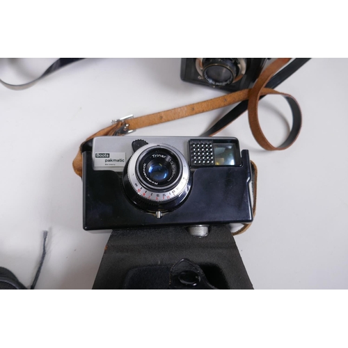 144 - Three vintage medium format film cameras including two Voigtlander Brilliant Compur and Lubitel 2, a... 