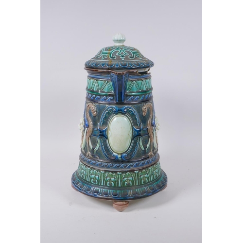 147 - A C19th continental Majolica jug and cover with lion mask decoration, signed and dated 1872 to the b... 