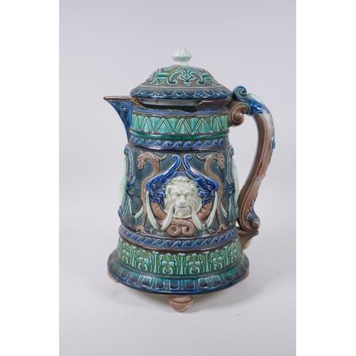 147 - A C19th continental Majolica jug and cover with lion mask decoration, signed and dated 1872 to the b... 