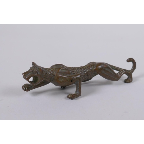 148 - A Japanese style bronze okimono in the form of a prowling leopard, 11cm long