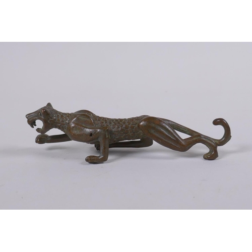 148 - A Japanese style bronze okimono in the form of a prowling leopard, 11cm long