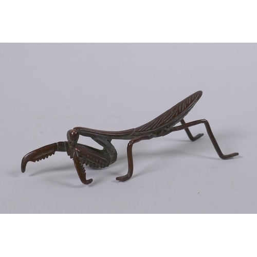 149 - A Japanese style bronze okimono in the form of a mantis, 8cm long