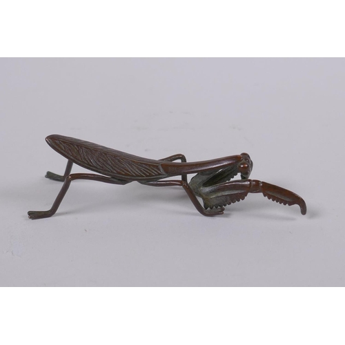 149 - A Japanese style bronze okimono in the form of a mantis, 8cm long