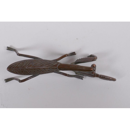 149 - A Japanese style bronze okimono in the form of a mantis, 8cm long