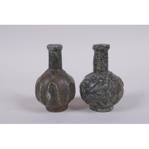 152 - A pair of antique Persian carved hardstone scent bottles, 7cm high