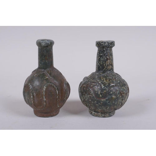 152 - A pair of antique Persian carved hardstone scent bottles, 7cm high