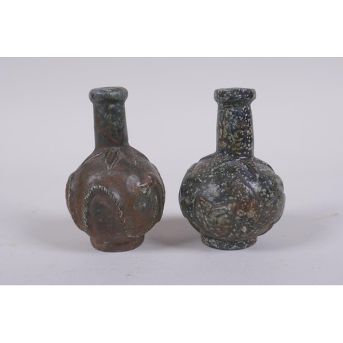 152 - A pair of antique Persian carved hardstone scent bottles, 7cm high