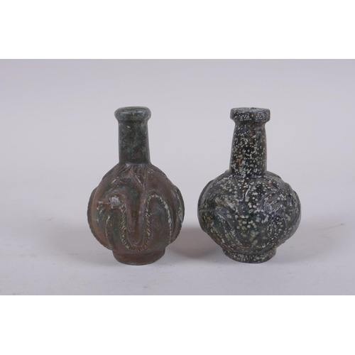 152 - A pair of antique Persian carved hardstone scent bottles, 7cm high