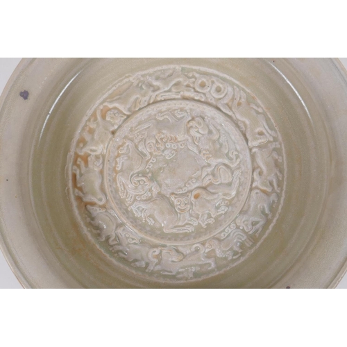 153 - A Chinese celadon ground porcelain dish, the bowl with raised decoration of the animals of the zodia... 