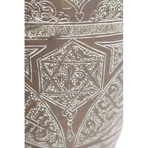 157 - An Islamic brass vase with chased script decoration, converted to a table lamp, 67cm high