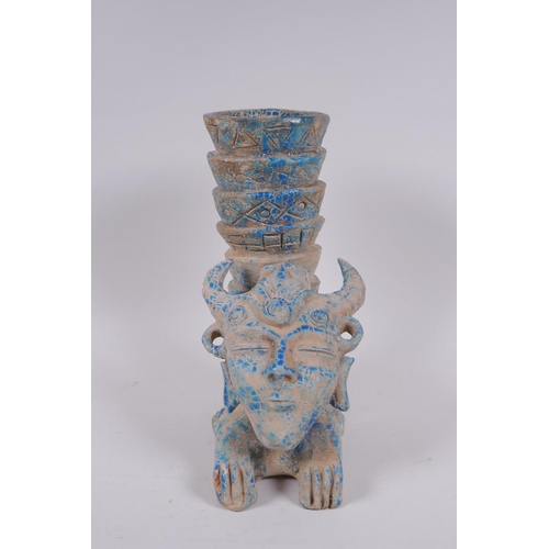 159 - An Islamic earthenware mask vase with turquoise crackle glaze, 25cm high