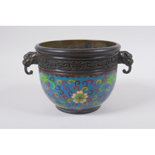 168 - A Chinese bronze censer with two dragon mask handles and cloisonne lotus flower decoration, impresse... 