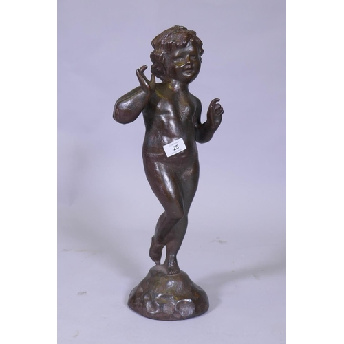 25 - A cast iron figure of a putto, 53cm high