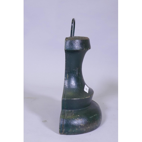 28 - A C19th painted wood bell shaped door stop, 41cm high