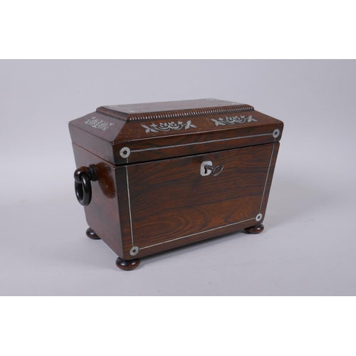 29 - A Victorian rosewood sarcophagus shaped tea caddy with silver and mother of pearl inlaid decoration,... 