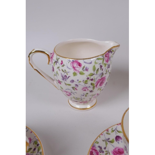 36 - An Arklow pottery six piece tea set with a transfer printed rose decoration, one teacup different, l... 