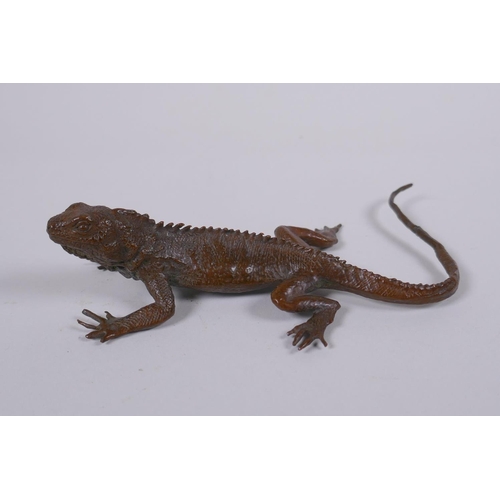 40 - A Japanese style bronze okimono lizard, impressed mark to the base, 15cm long