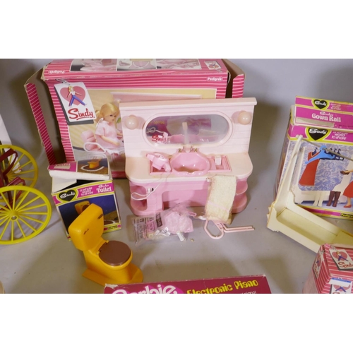 42 - A large collection of vintage pedigree Sindy dolls and accessories, including two 1981/82 Sindy doll... 