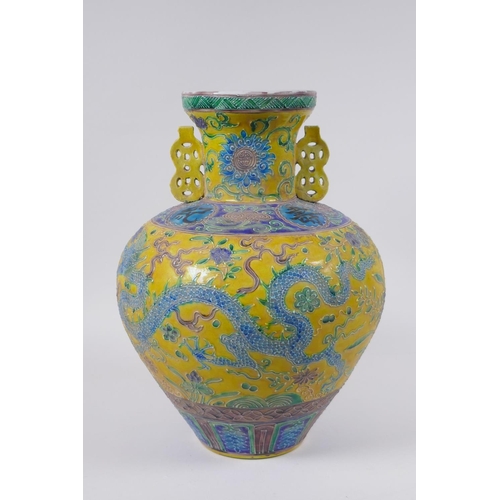 45 - A Chinese Fahua porcelain vase with two handles, decorated with a phoenix, dragon and flowers in the... 