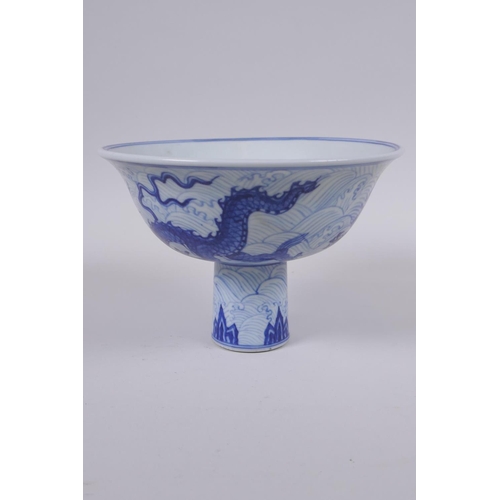 48 - A Chinese blue and white porcelain stem bowl decorated with dragons, Xuande 6 character mark to bowl... 