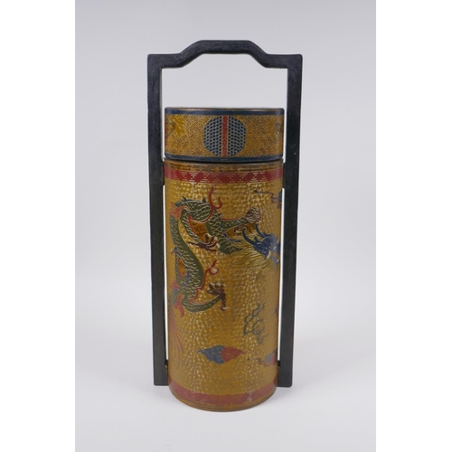 50 - A Chinese gilt lacquered cylinder container with chased and painted dragon decoration, the cover wit... 