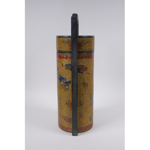 50 - A Chinese gilt lacquered cylinder container with chased and painted dragon decoration, the cover wit... 