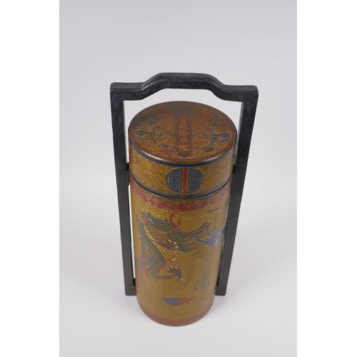 50 - A Chinese gilt lacquered cylinder container with chased and painted dragon decoration, the cover wit... 