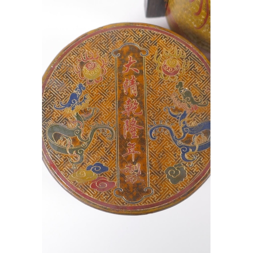 50 - A Chinese gilt lacquered cylinder container with chased and painted dragon decoration, the cover wit... 