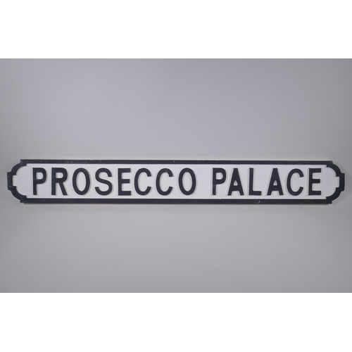 56 - A painted wood sign, Prosecco Palace', the style of a road sign, 105cm long x 14cm high