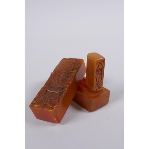 58 - A Chinese amber soapstone box containing an amber soapstone seal, the cover with carved decoration o... 