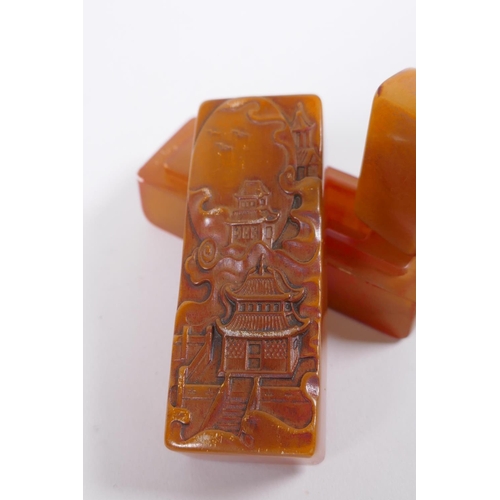 58 - A Chinese amber soapstone box containing an amber soapstone seal, the cover with carved decoration o... 