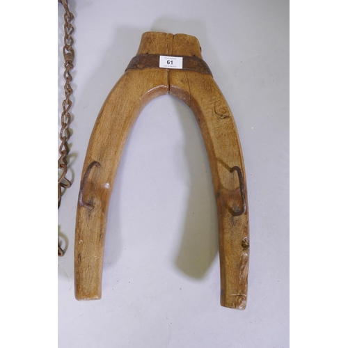 61 - A C19th painted wood yoke, 88cm long and a donkey's collar