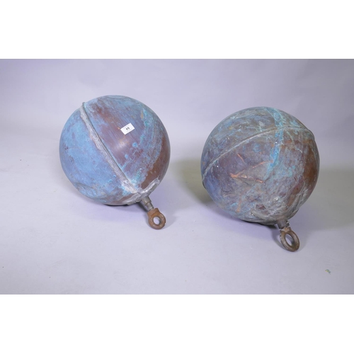 64 - A pair of large copper floats, by repute ex Ancaster brewery, 50cm high