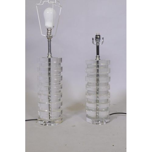 67 - A pair of glass table lamps with chromed mounts, 46cm high